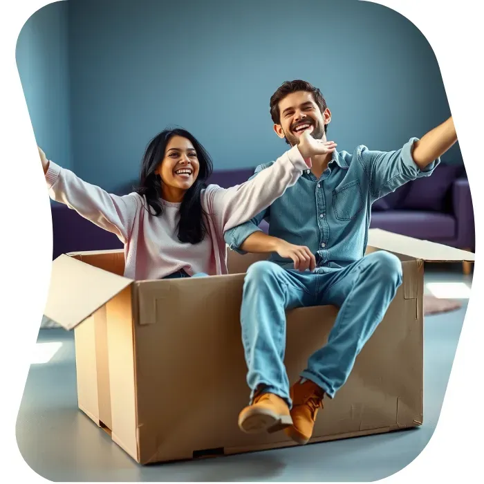 Two guys sitting on the floor of their apartment with Muval moving boxes
